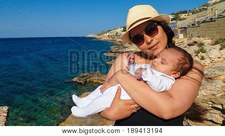 mum and baby on the beach, Malta, Mellieha