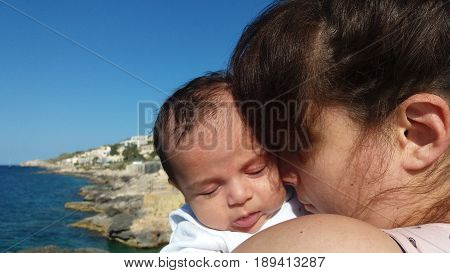 mum and baby on the beach Malta, Mellieha