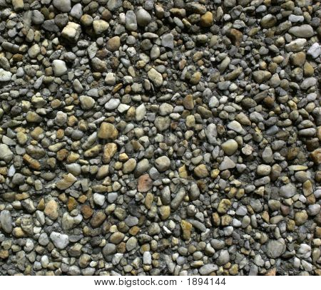 Guijarros en un patrón al azar en concreto