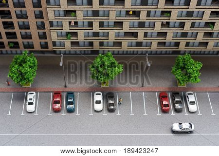 Miniature model, miniature toy buildings, cars and people. City maquette