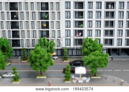 Miniature model, miniature toy buildings, cars and people. City maquette