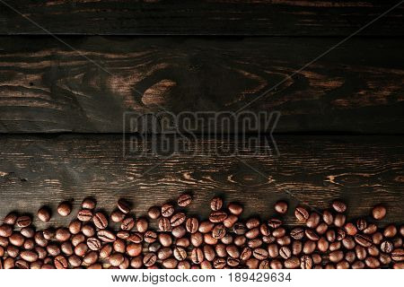 coffee beans on table black wood background
