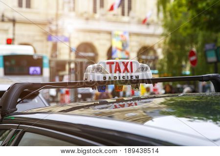 Close-up of taxi sign in Paris, France