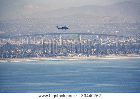 Helicopter hovering over the city and the bay