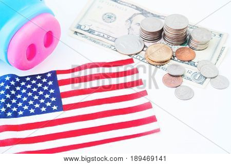 USA flag stack of coins and dollors Travel America concept