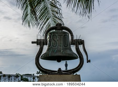 Depth of field view of lighthouse seen through a fog bell