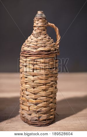 Glass Bottle For Rakia Protected By Wood Mesh