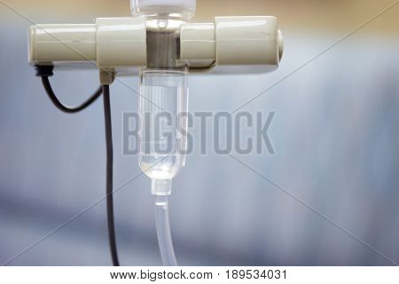 Saline IV drip for patient and Infusion pump in hospital.