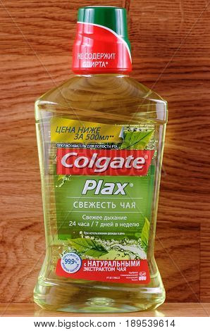 SARANSK, RUSSIA - June 03, 2017: Colgate Plax Mouthwash on wooden table.