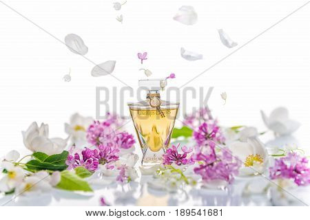 Saratov, Russia -  May 9, 2017: Champs Elysees Eau De Toilette Guerlain With Lilac Bush And Spring F