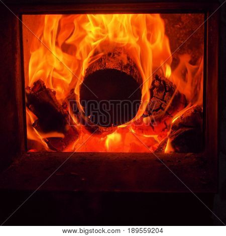 The flames in the firebox. Burning firewood. The firebox of the furnace. Bath.