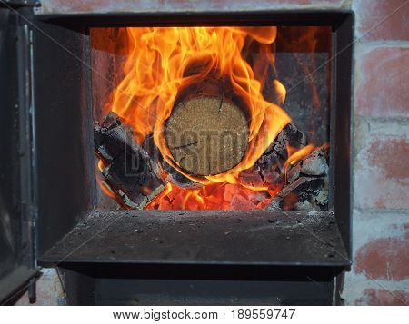 The flames in the firebox. Burning firewood. The firebox of the furnace. Bath.
