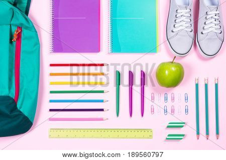 Flat Lay With Various School Supplies On Colorful Surface
