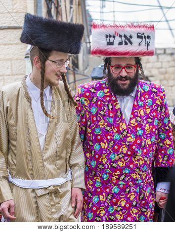 JERUSALEM - MARCH 13 : Ultra Orthodox men during Purim in Mea Shearim Jerusalem on March 13 2017 Purim is a Jewish holiday celebrates the salvation of the jews from genocide in ancient Persia