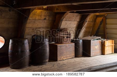 wooden crates and barrels on board of a restored dutch VOC ship