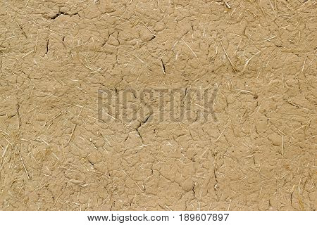 Old Clay Wall Cracked Straw Background