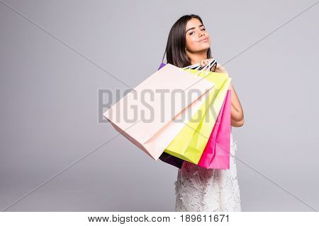 Young Happy Summer Shopping Woman With Shopping Bags On Grey Background
