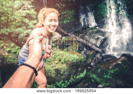 Male and woman couples asia. Walking hand travelers travel nature Forests mountains waterfalls. puhinrongkla romklao-paradorn waterfall
