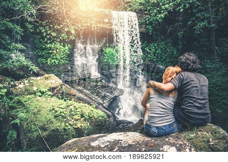 Male and woman couples asia. Walking hand travelers travel nature Forests mountains waterfalls. puhinrongkla romklao-paradorn waterfall