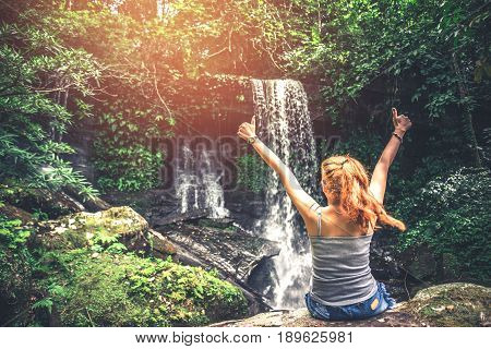 Male and woman couples asia. Walking hand travelers travel nature Forests mountains waterfalls. puhinrongkla romklao-paradorn waterfall