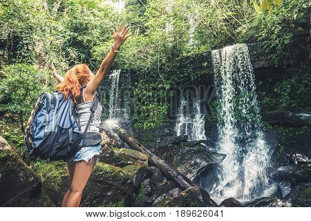 woman asia travelers travel. Walking hand travelers travel nature Forests mountains waterfalls. puhinrongkla romklao-paradorn waterfall