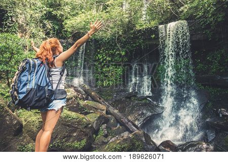 woman asia travelers travel. Walking hand travelers travel nature Forests mountains waterfalls. puhinrongkla romklao-paradorn waterfall