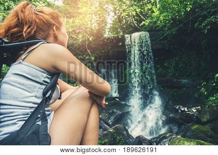 woman asia travelers travel. Walking hand travelers travel nature Forests mountains waterfalls. puhinrongkla romklao-paradorn waterfall