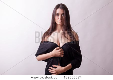 Sexy sensual busty woman on gray background. Sexy lady. Perfect beautiful attractive female posing in model test in studio