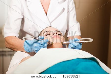 Conceptual beauty and cosmetology image of the hands of several beauticians holding their respective equipment. Beauty concept. Cosmetology concept. Cosmetology salon. Cosmetic procedures mesotherapy.