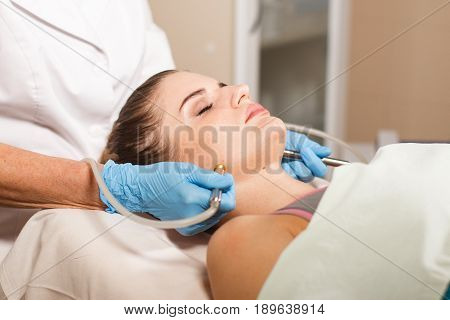 .Conceptual beauty and cosmetology image of the hands of several beauticians holding their respective equipment. Beauty concept. Cosmetology concept. Cosmetology salon. Cosmetic procedures mesotherapy