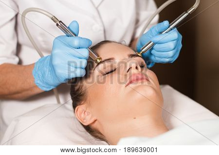Conceptual beauty and cosmetology image of the hands of several beauticians holding their respective equipment. Beauty concept. Cosmetology concept. Cosmetology salon. Cosmetic procedures mesotherapy.