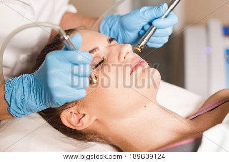 Conceptual beauty and cosmetology image of the hands of several beauticians holding their respective equipment. Beauty concept. Cosmetology concept. Cosmetology salon. Cosmetic procedures mesotherapy.