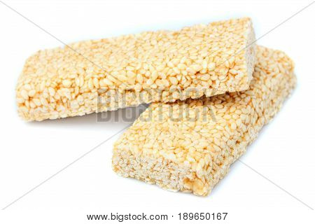 Two pieces of gozinaki confection sweets isolated on white background.
