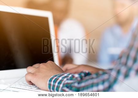 Image of man's hands typing. Selective focus.