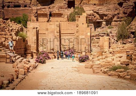 PETRA, JORDAN. May 1, 2014. The arched Roman gate of the ancient Nabataean city of Petra. It's considered one of the modern wonders of the world, a tourist must see. Petra stock image.