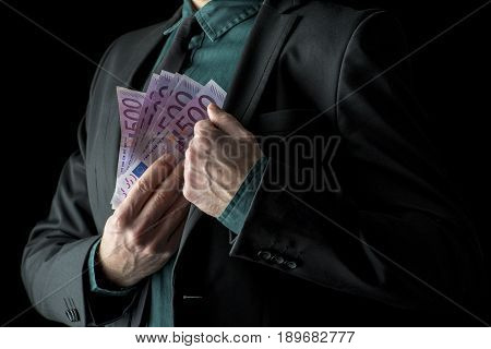 Businessman In Black Suit Holding 500 Euro Bills