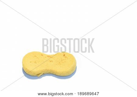 Sponge on the white table. Sponge's use with water soap or detergent to wash everything that dirty.