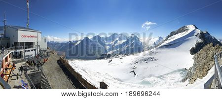 SILVAPLANA SWITZERLAND AUG 20 2010: Panoramic view on Alpine mountain funicular station Corvatsch Corvatsch Peak Swiss Alpine mountains holidays vacation tours tourists travel. Panorama Matterhorn