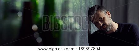 Sad Man And Glass Bottles