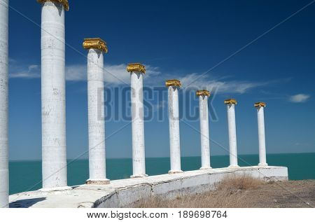 White colonnade in Priozersk city (former Soviet anti-ballistic missile testing range Sary Shagan), Kazakhstan.Lake Balkhash coast.Town decoration.May 6, 2017.Priozersk.Kazakhstan