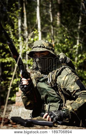 A group of special forces in a field with weapons