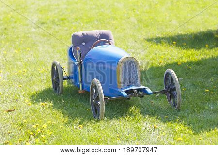 STOCKHOLM SWEDEN - MAY 21 2017: Beautiful blue soapbox car parked on the grass in the race Gardesloppet at Djurgarden Stockholm Sweden. May 21 2017