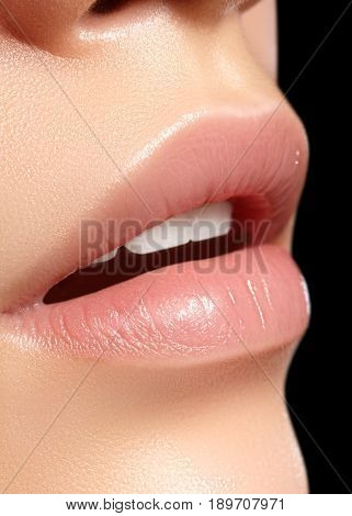 Close-up perfect natural lip makeup beautiful female mouth. Plump sexy full lips. Macro photo face detail. Perfect clean skin fresh lip make-up. Beautiful spa tender lips