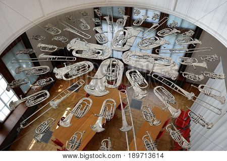 LONDON, ENGLAND - May 24,2017: flattened brass music instruments, sculpture 