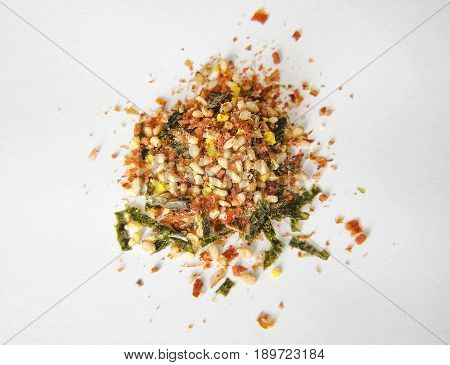 Small portion of Furikake on a white background with depth of field.
