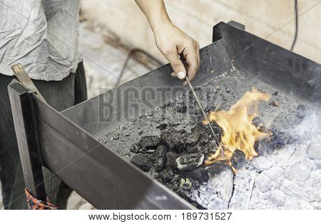 Blacksmith Heating Up Iron