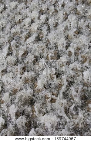 rough water of the fountain as a backdrop