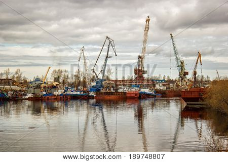 the image ship repair dock, tug river crane