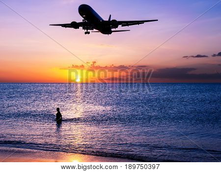 Beach Sand With Airplane And Sky Sunset In Twilight