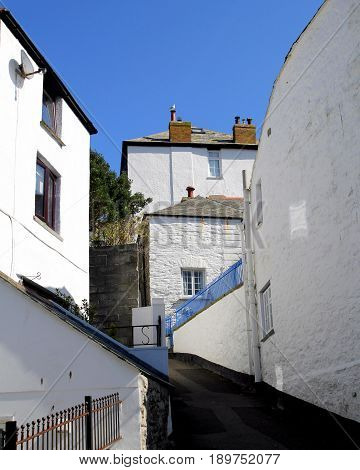 Quiet deserted narrow street in a picturesque fishing village in England